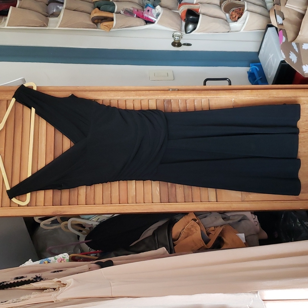 Sleeveless black knit dress with draping around the waist brand ruby size medium